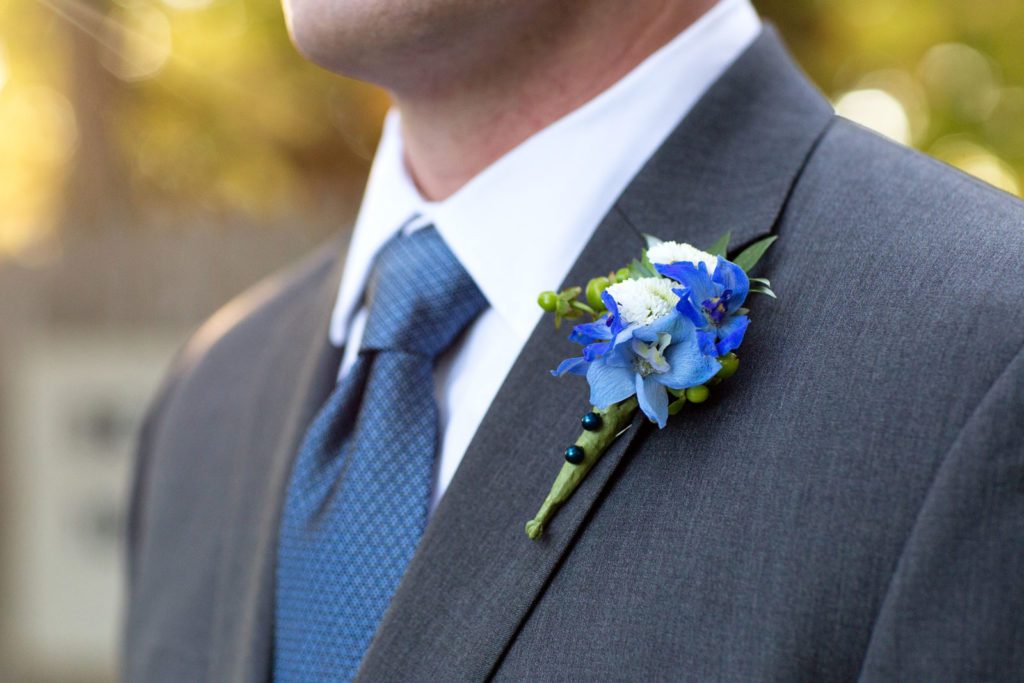 Close up of David's blue and white boutonnière.