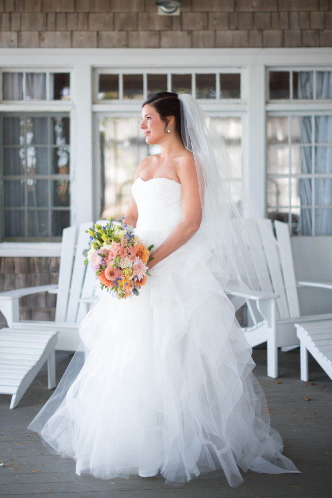 Bride in wedding dress with bouquet.