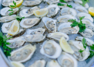 Close up of oyster tray with lemons.