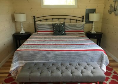 Quarterdeck Cabin king bed.
