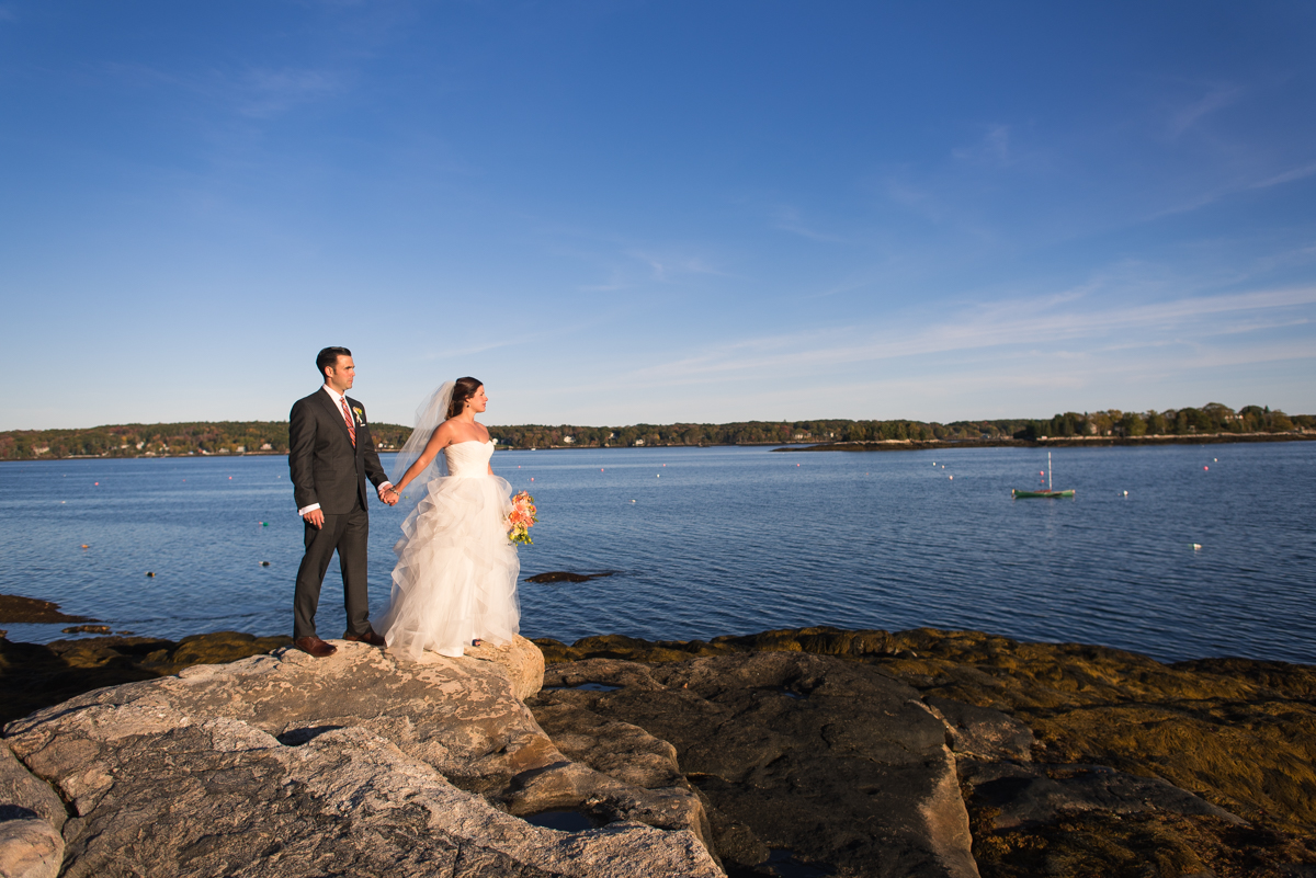 Couple standing on the rocks.