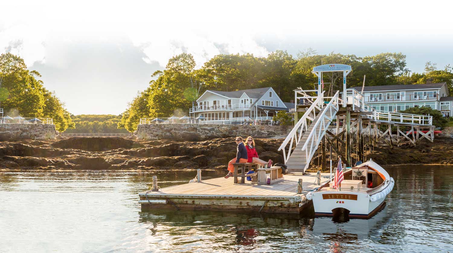 Women sitting on the dock.