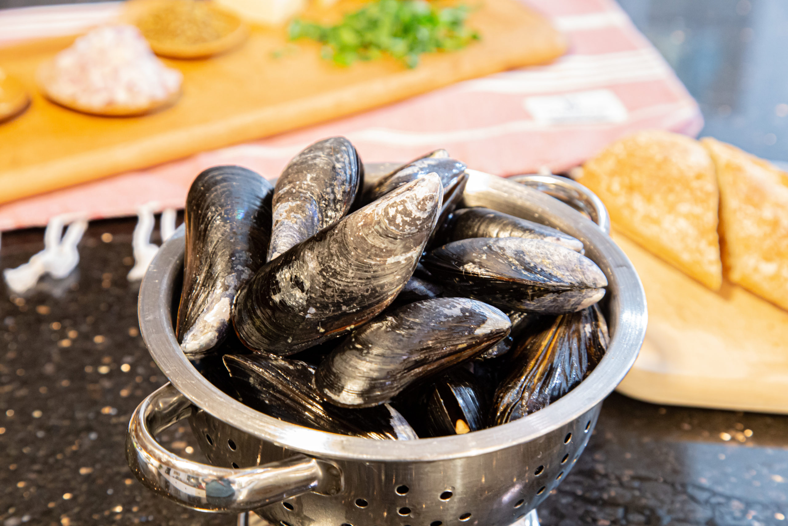 Mussels in a collander.
