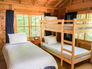 Bedroom with twin bed and bunk bed.