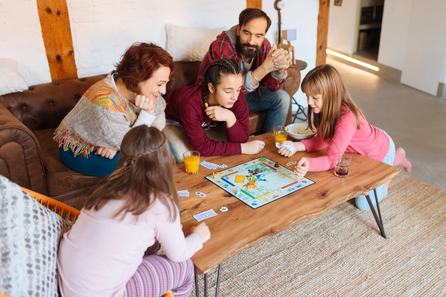 Picture of family enjoying rainy day inside their Boothbay Harbor resort.