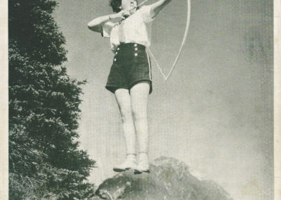Woman shooting an arrow.