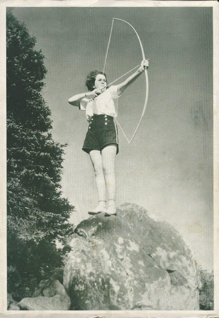 Woman shooting an arrow.