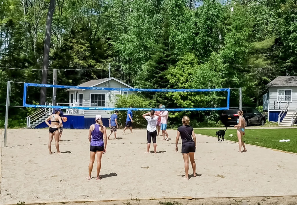 People playing beach volleyball.