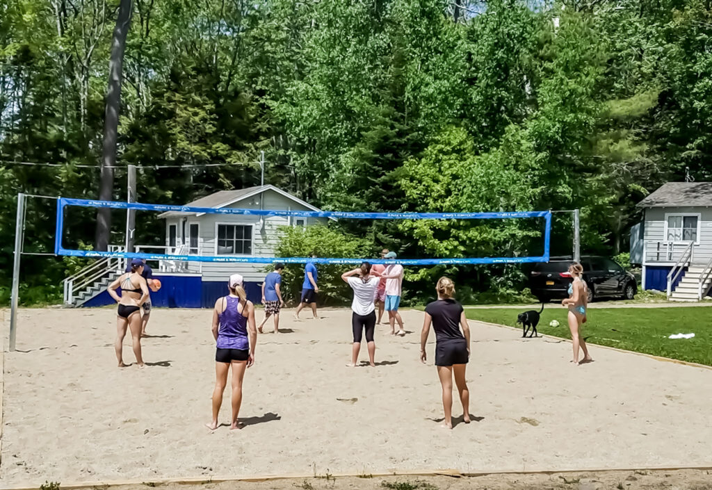 Group playing beach volleyball.