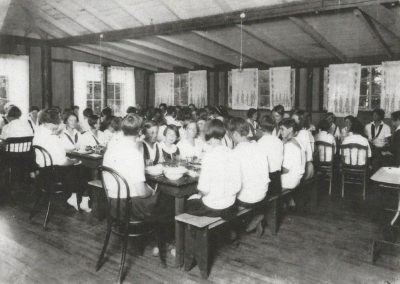 Young women dining together in the hall.