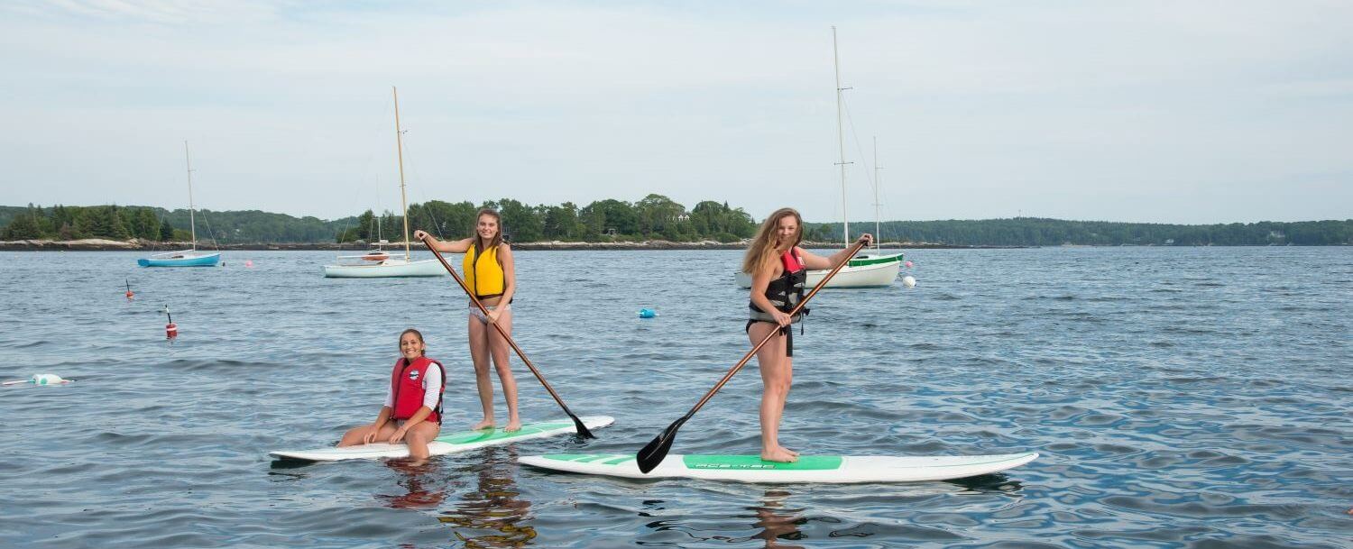 Paddleboarding is one of the top things to don on the water near Boothbay Harbor Maine.