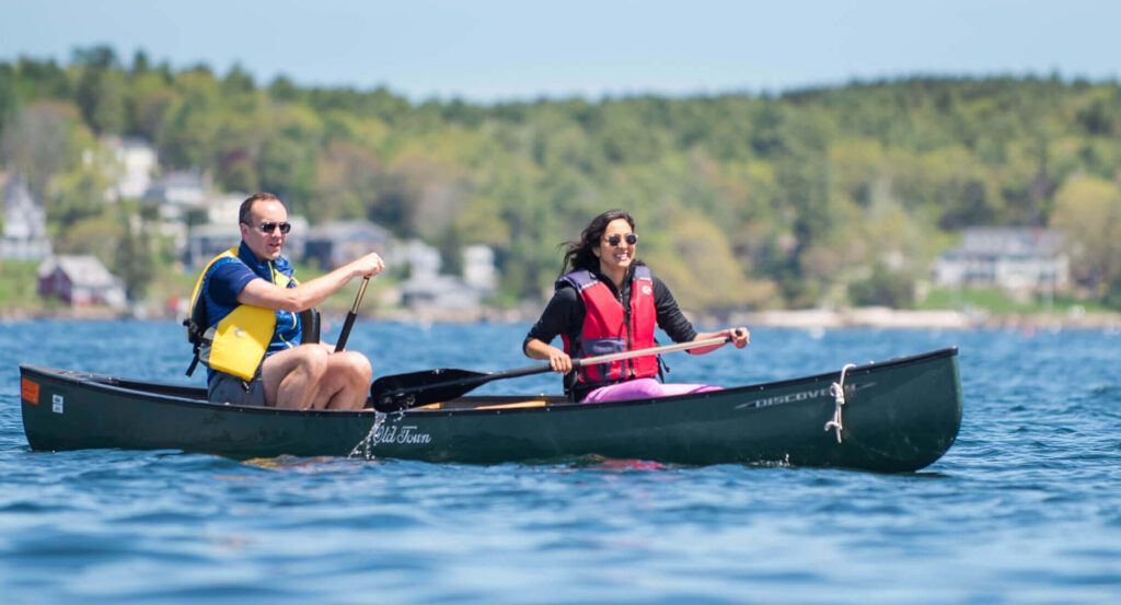 Photo of two people paddling during a romantic getaway in Maine at Linekin Bay Resort