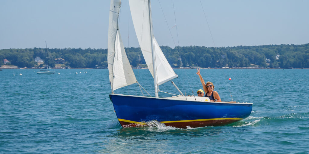 Couple sailing at Linekin Bay Resort - New Englands only sailing resort.