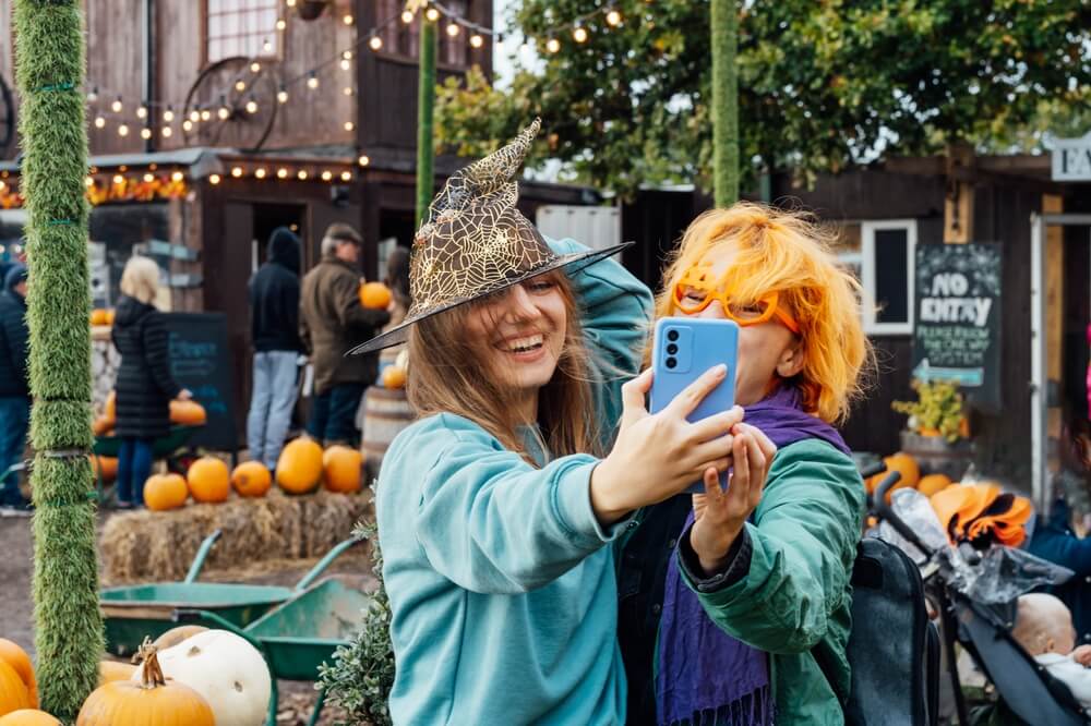 People at fall festivals in Maine taking a selfie